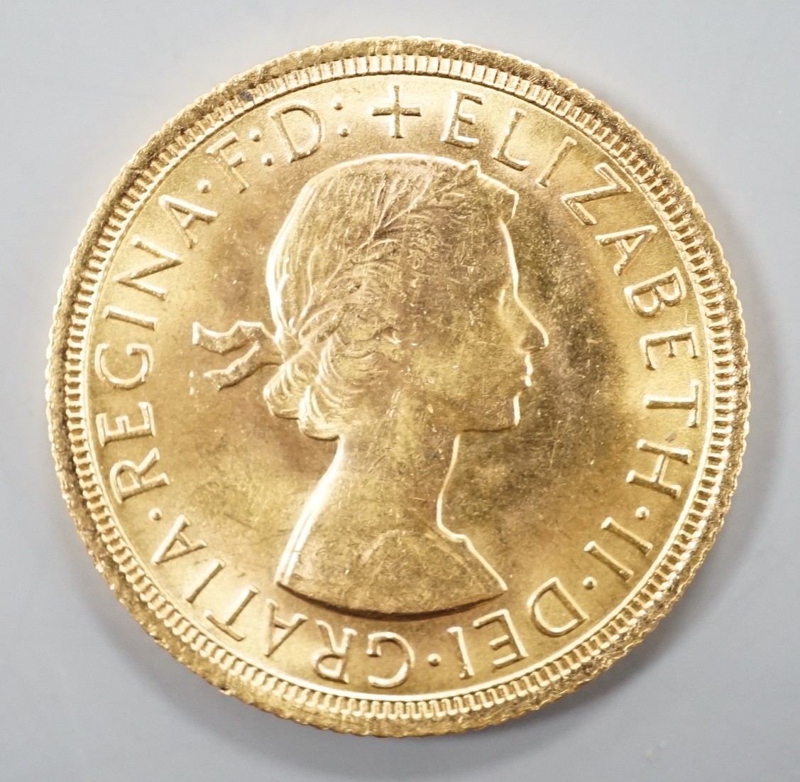 An Elizabeth II 1966 gold sovereign.